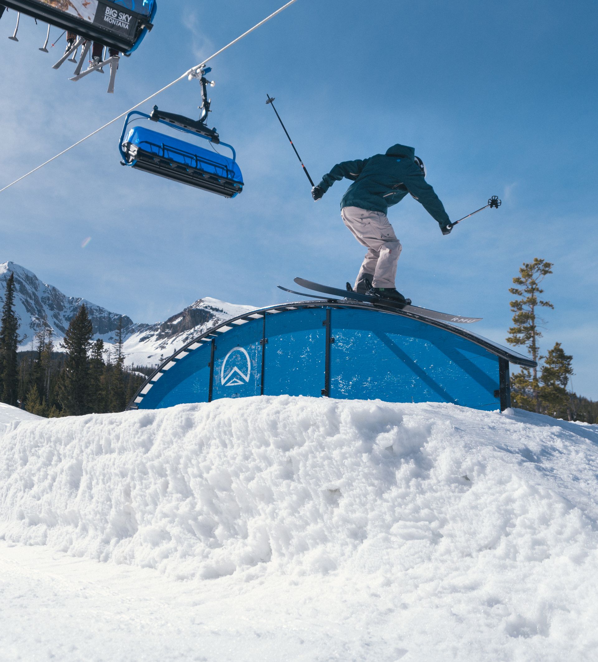 Skier on a rail in the terrain park