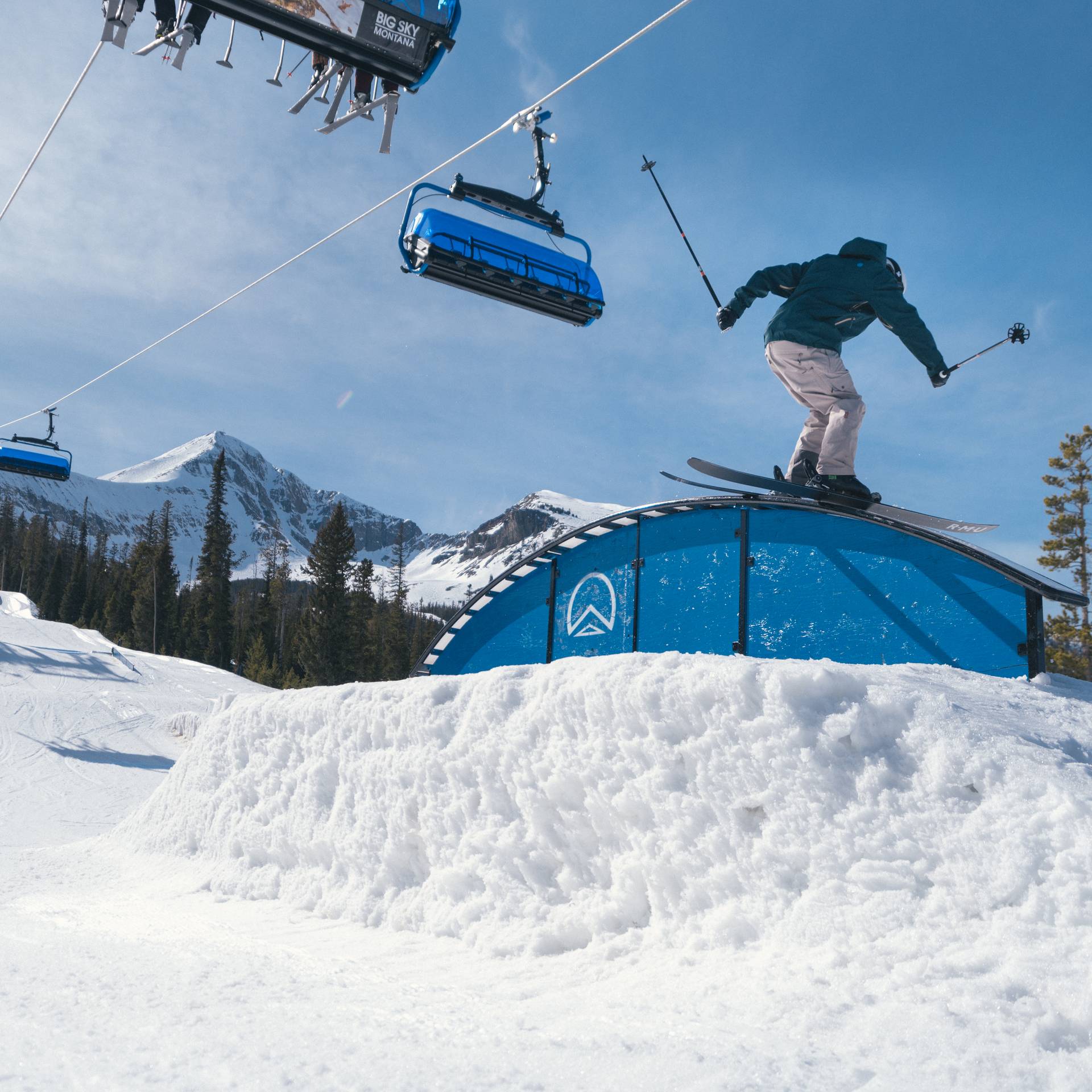 Skier on a rail in the terrain park