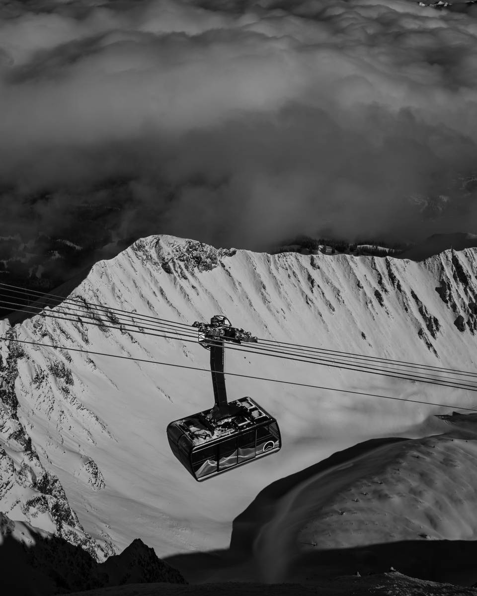 Black and white photo of the Lone Peak Tram and A-Z ridge in winter