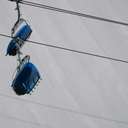 Chairlift with ski terrain in the background