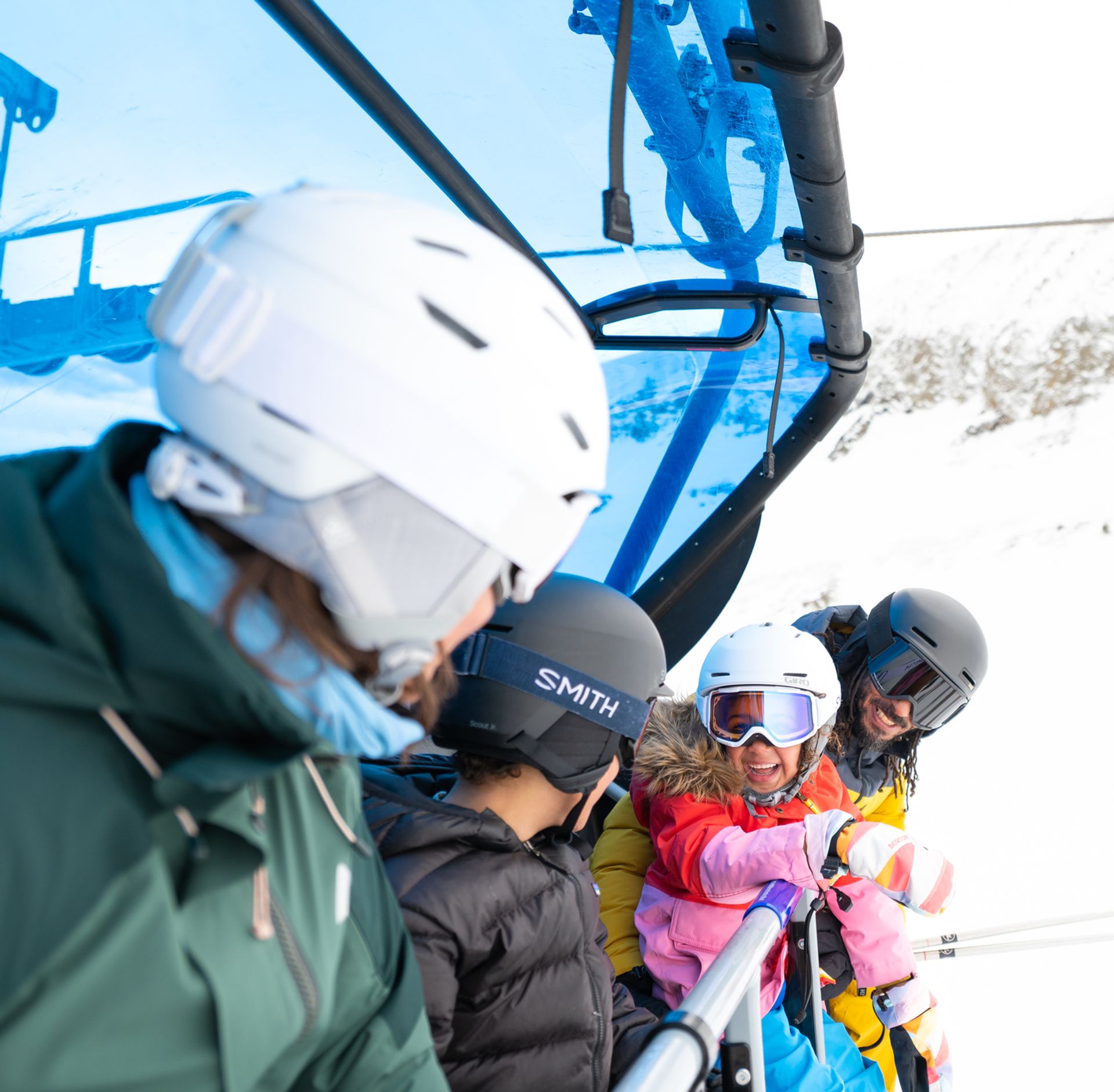 Family of skiers riding a chairlift