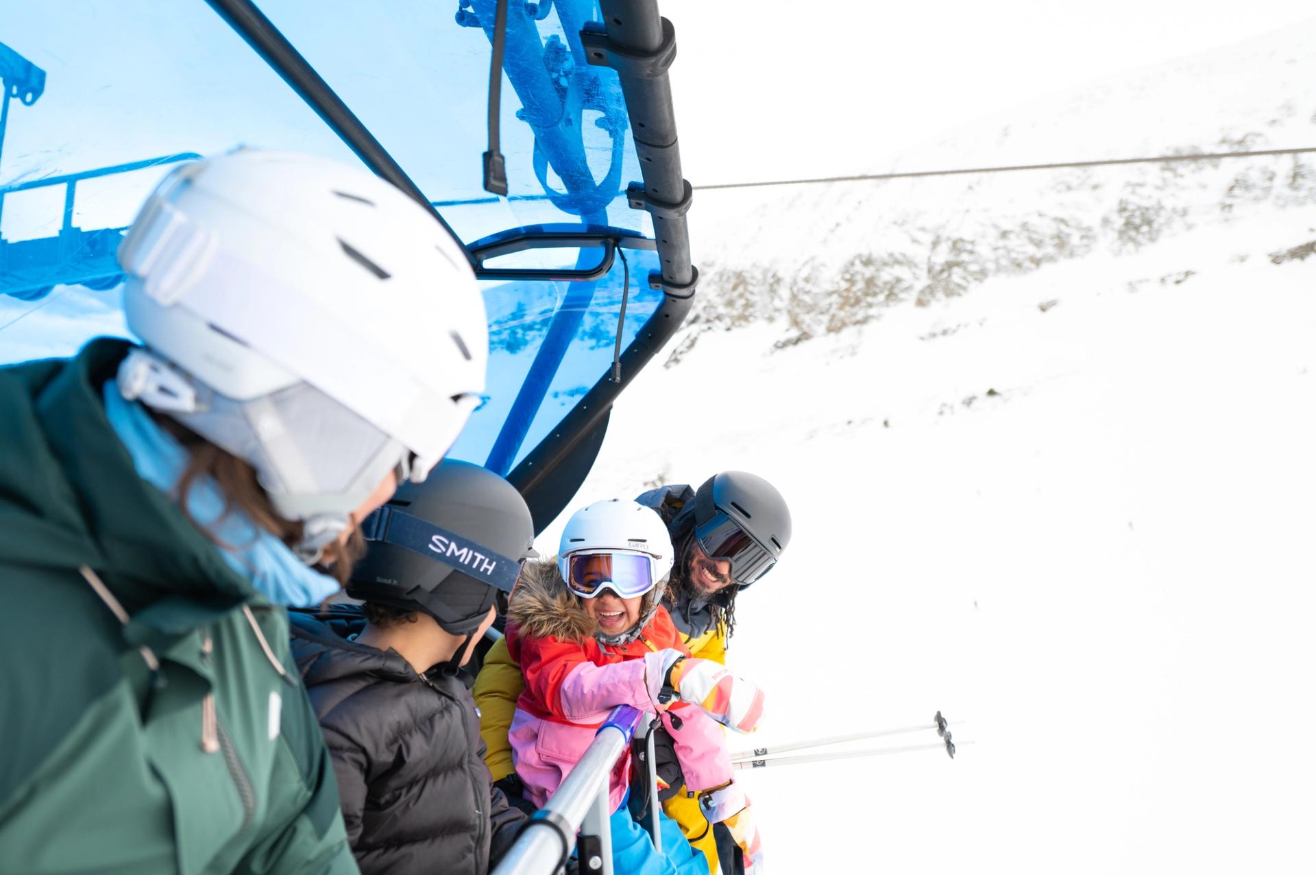 A family riding a chairlift