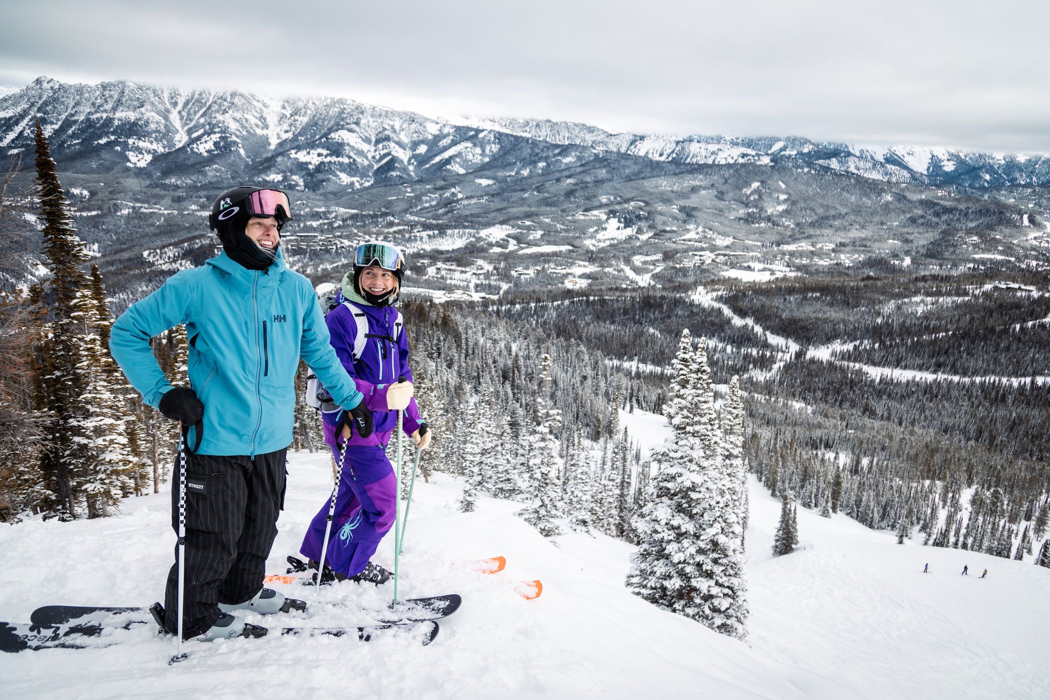 Two skiers standing on a powdery run