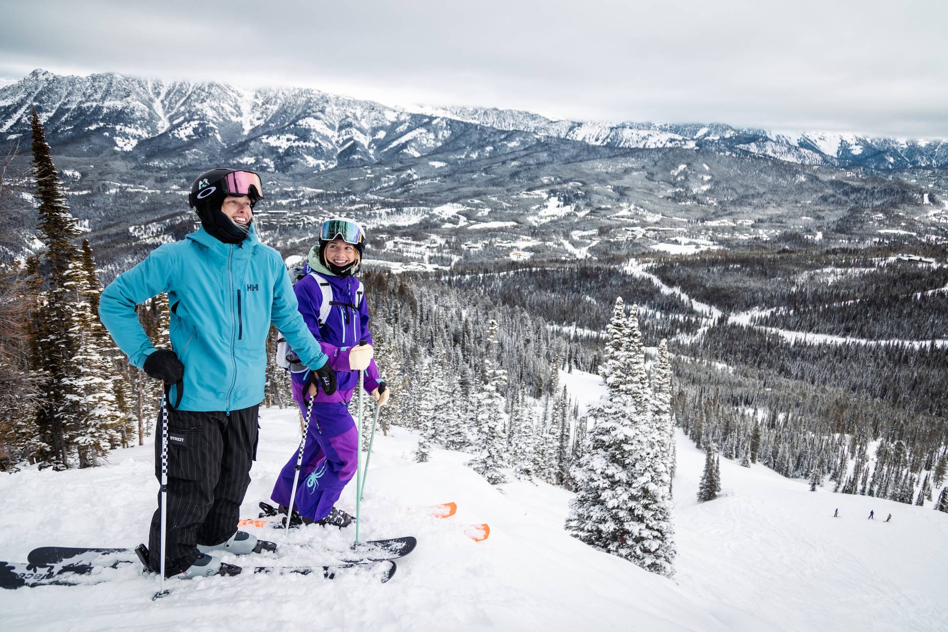 Two skiers standing on a powdery run