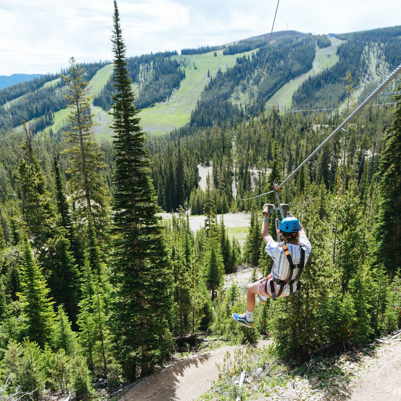 Person on a zipline at Big Sky Resort