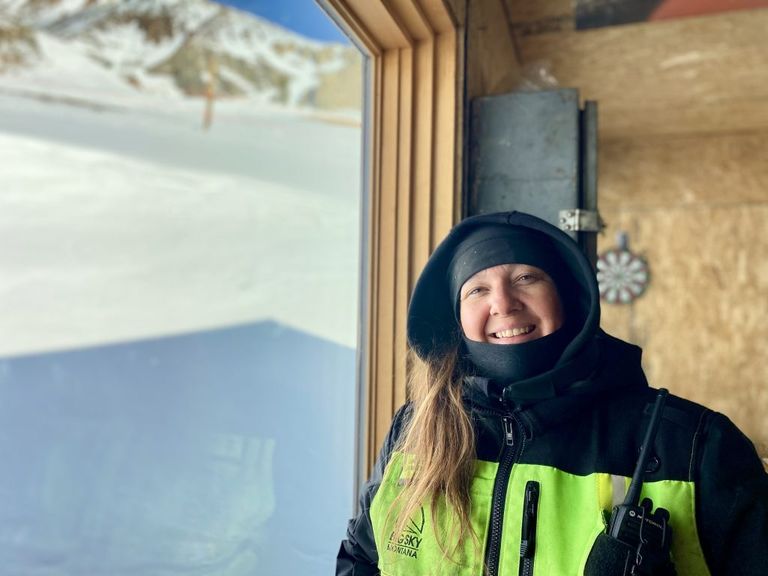 Bessler smiles at the camera from inside the lower Powder Seeker lift station