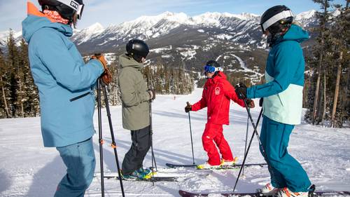 Adults in a group ski lesson