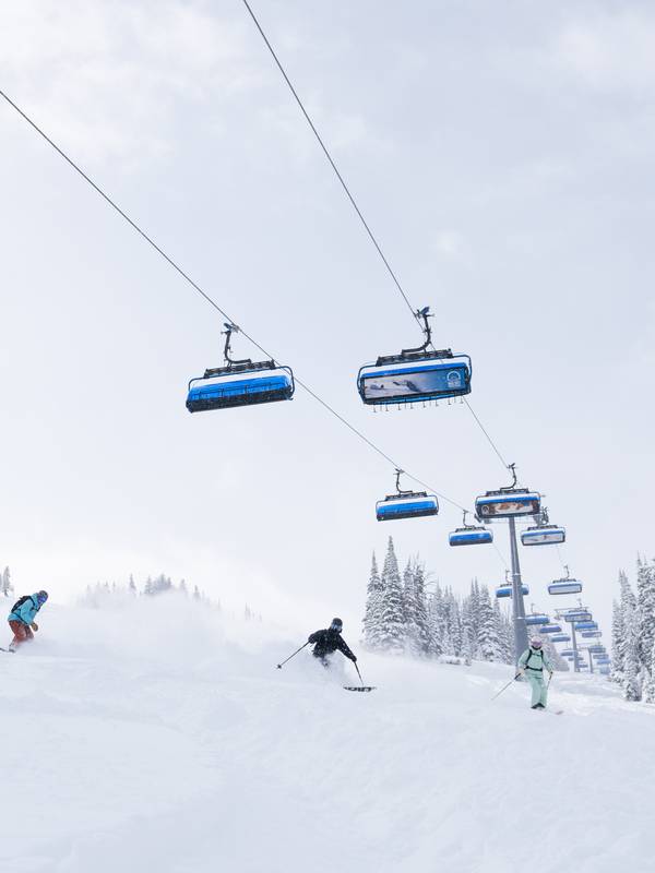 Skiers under Ramcharger 8