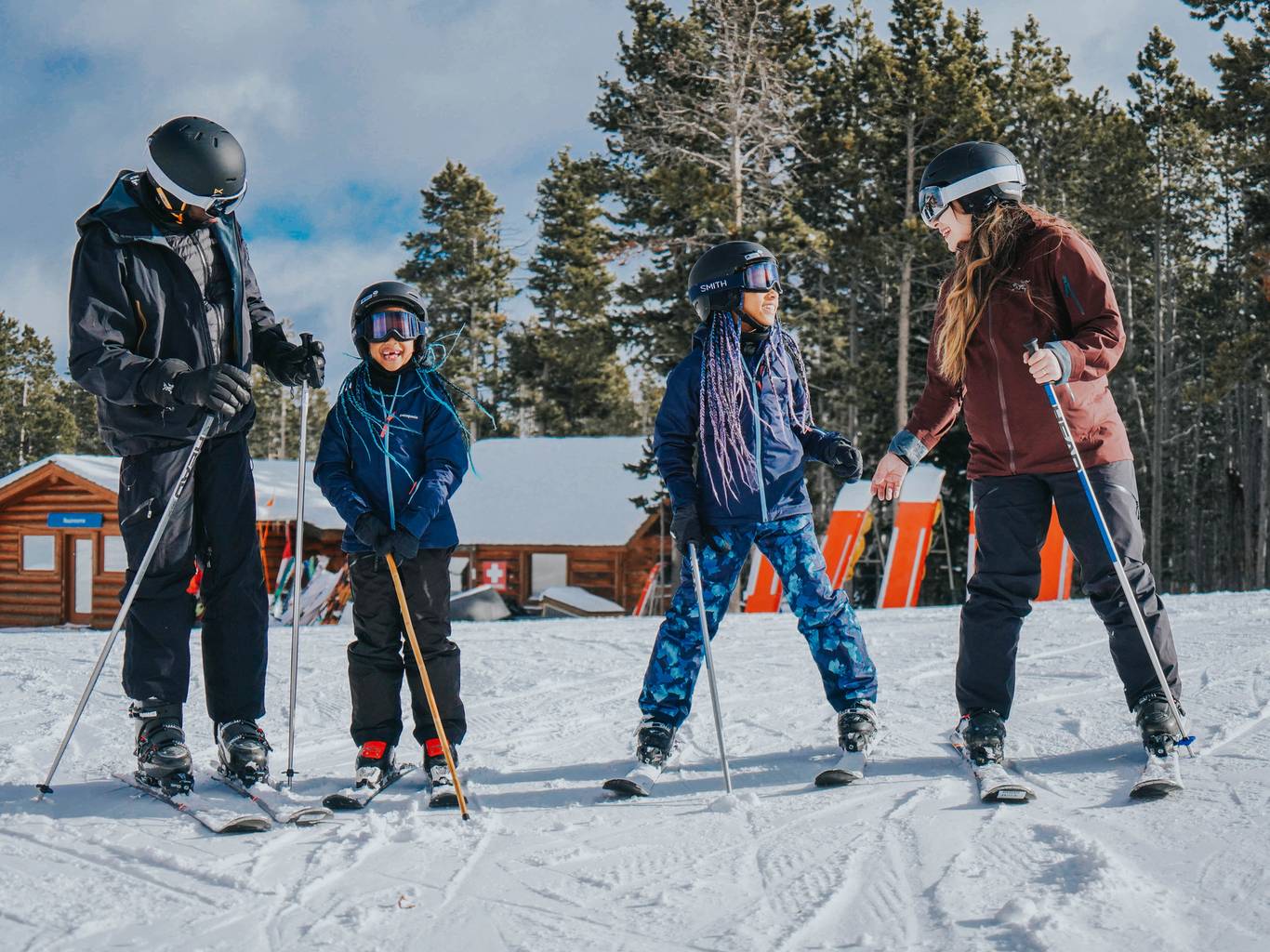 Family standing in ski gear