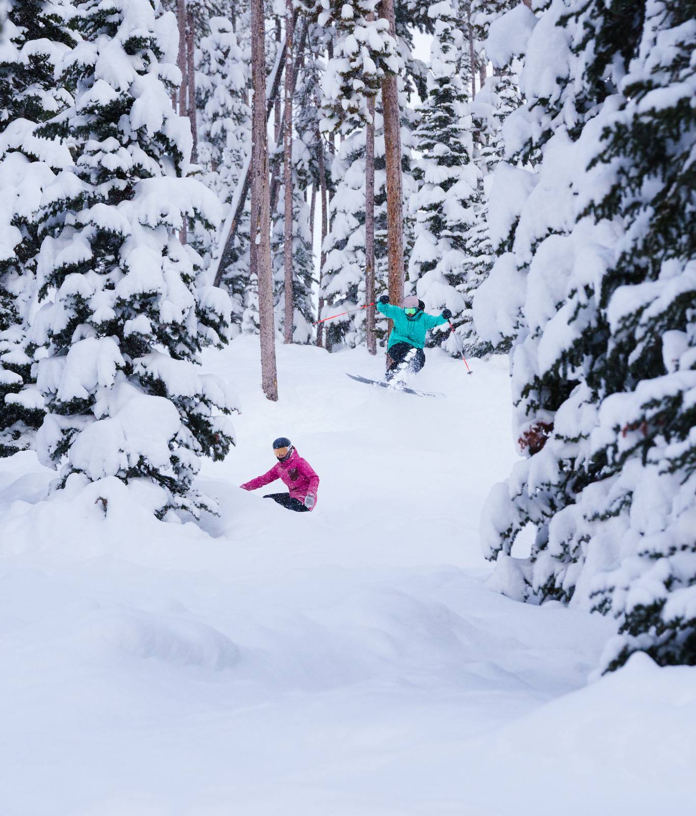 People in ski and snowboard gear on a chairlift at Big Sky Resort