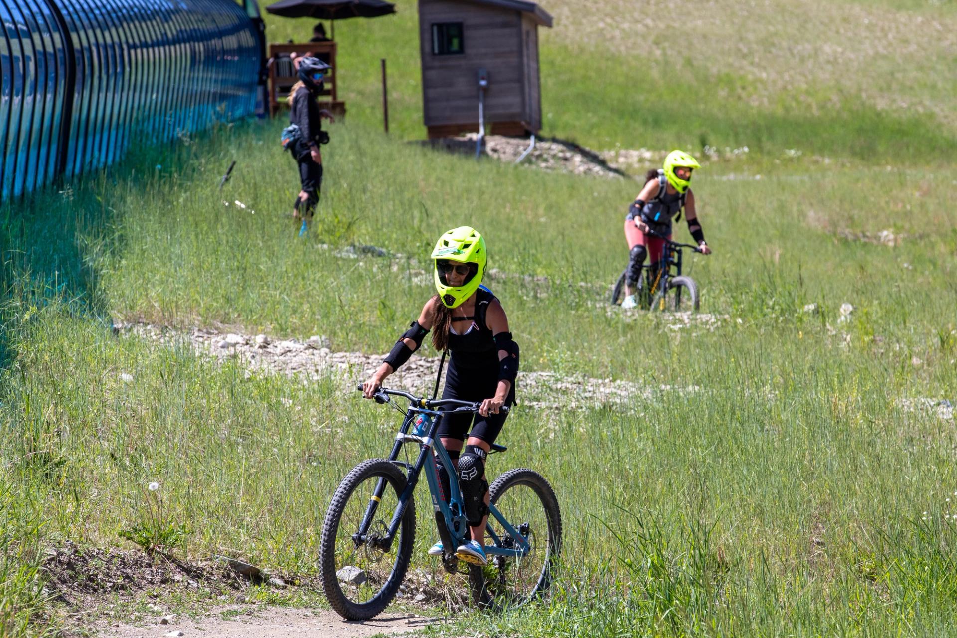 A beginner group rides down their first trail