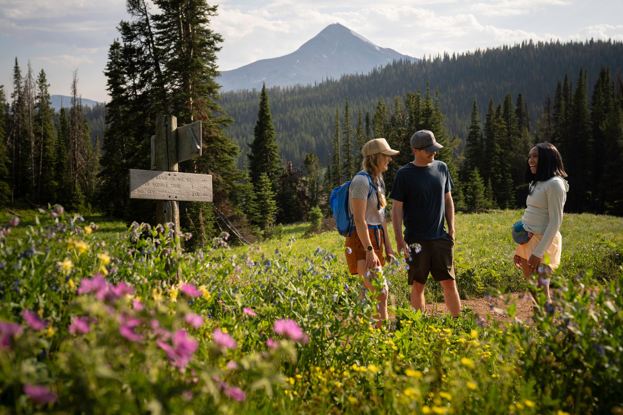 People on a hike with Lone Peak in the background