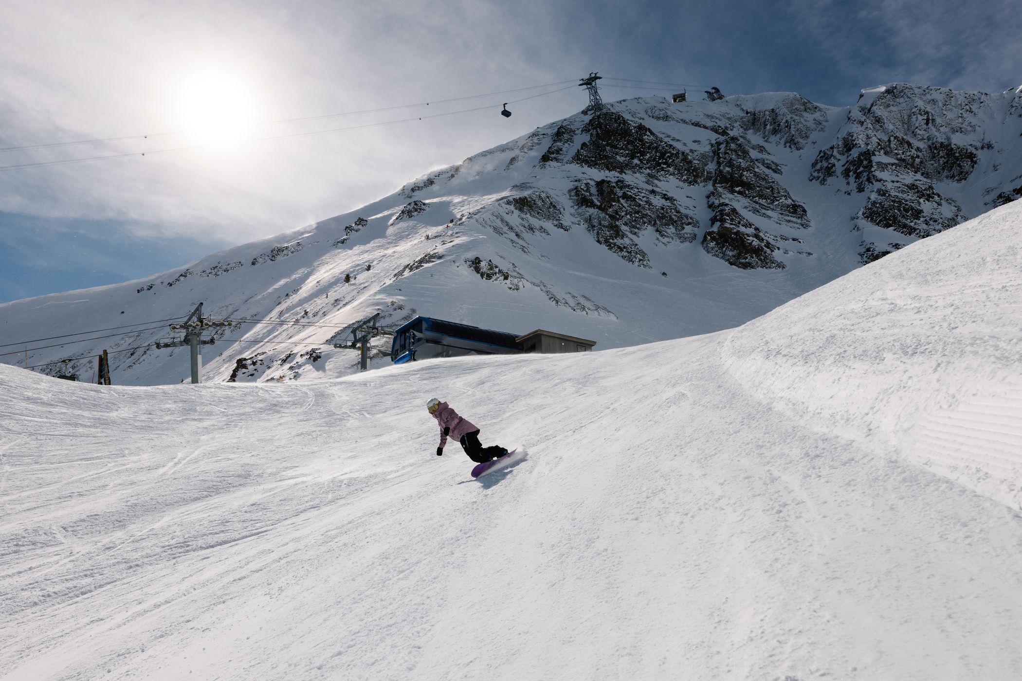 Snowboarder on a groomed run at Big Sky Resort