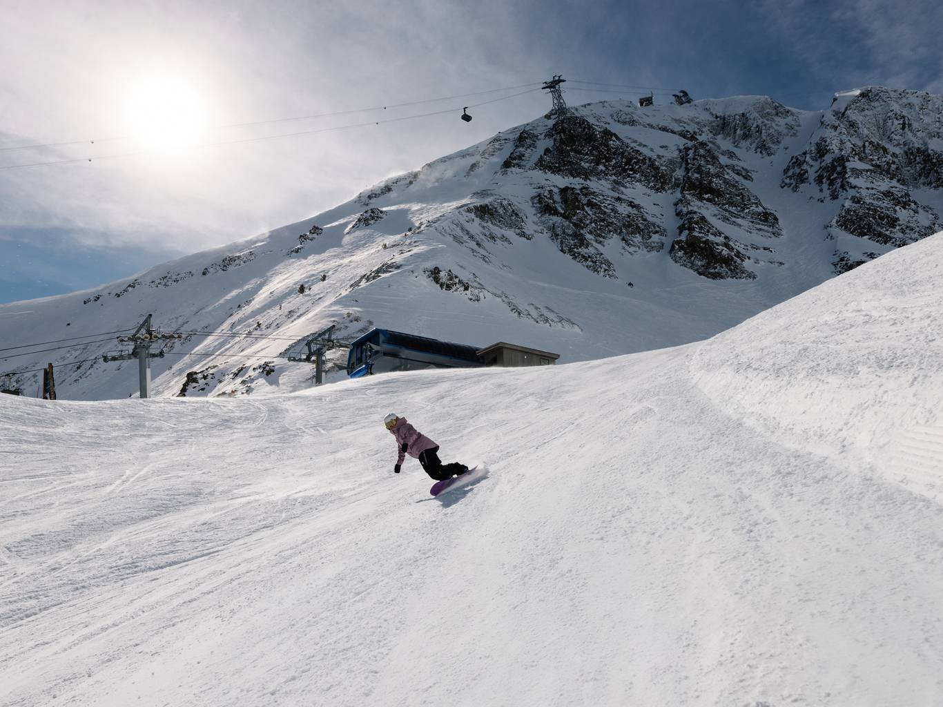 Snowboarder on a groomed run at Big Sky Resort