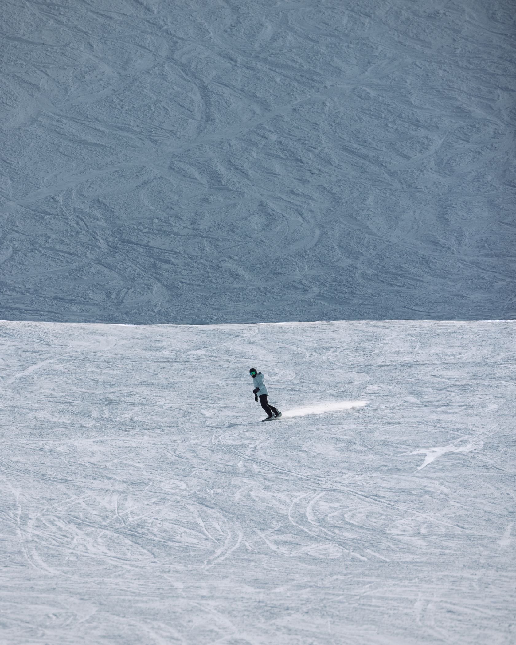 Snowboarder on a groomed run