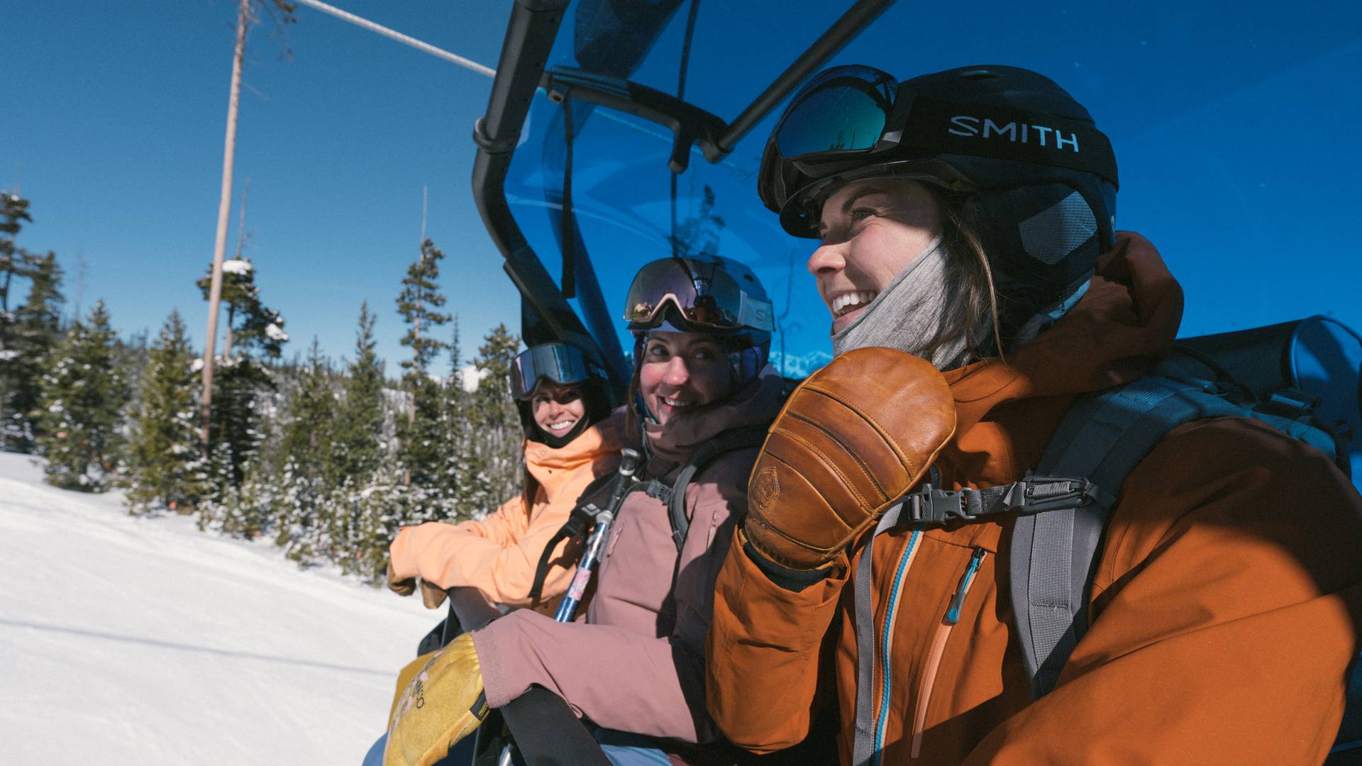 Snowboarders on a chairlift