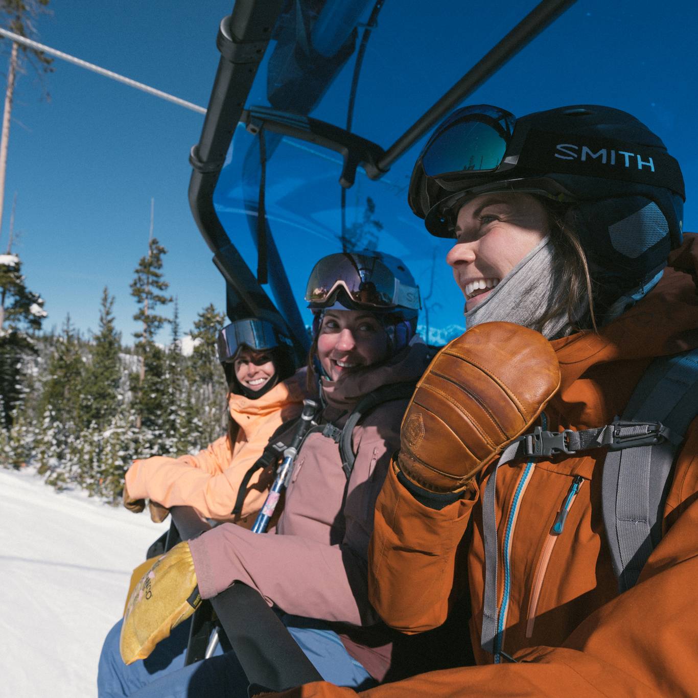 Snowboarders on a chairlift
