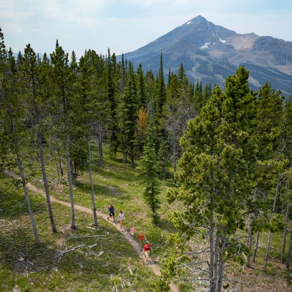 Family on a hike with Lone Mountain in the background