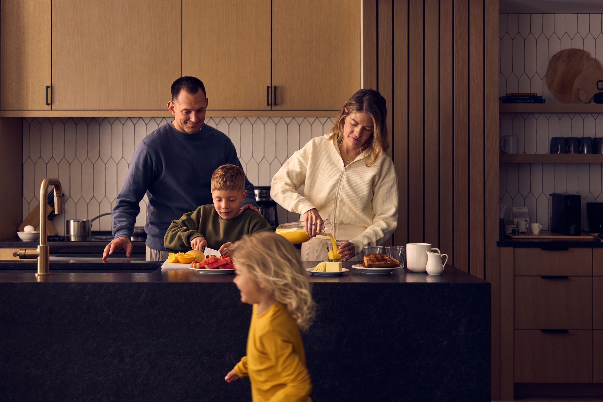 Family making breakfast in a vacation rental