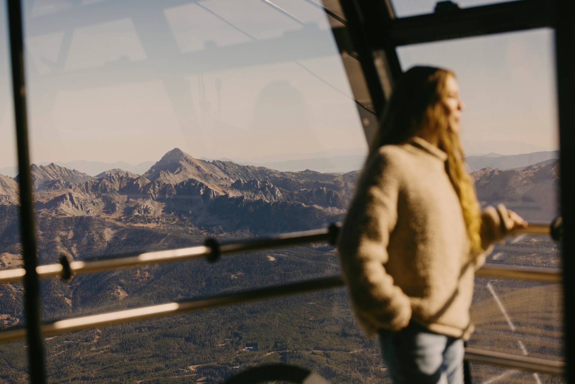 Woman looking out of the Lone Peak Tram
