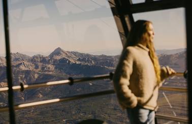 Woman looking out of the Lone Peak Tram