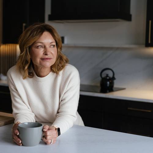 Woman relaxing in a kitchen