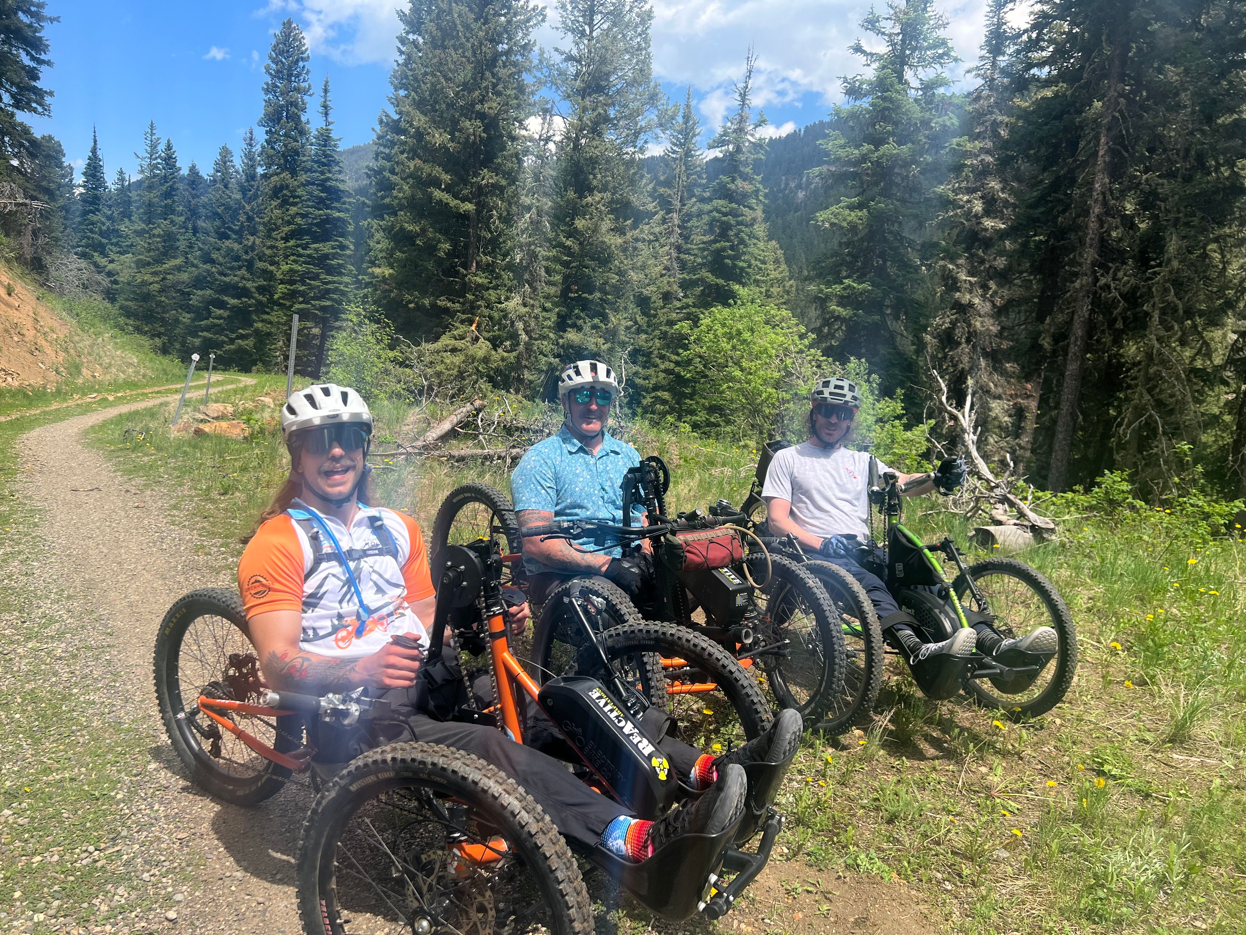 Adaptive mountain bikers on a trail in Big Sky, Montana