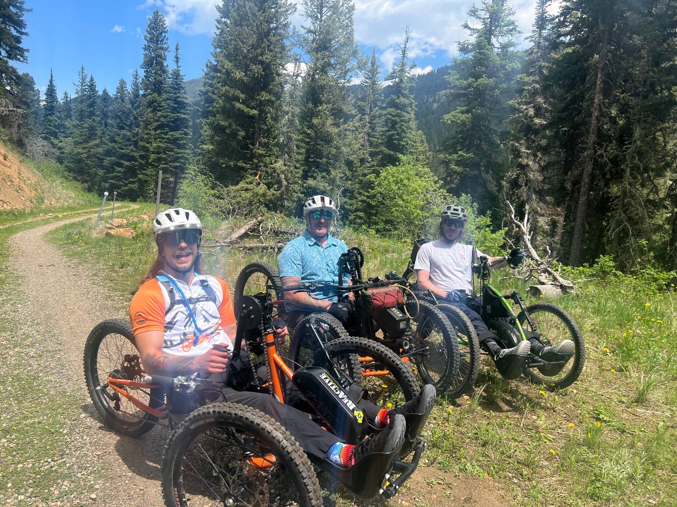 Adaptive mountain bikers on a trail in Big Sky, Montana