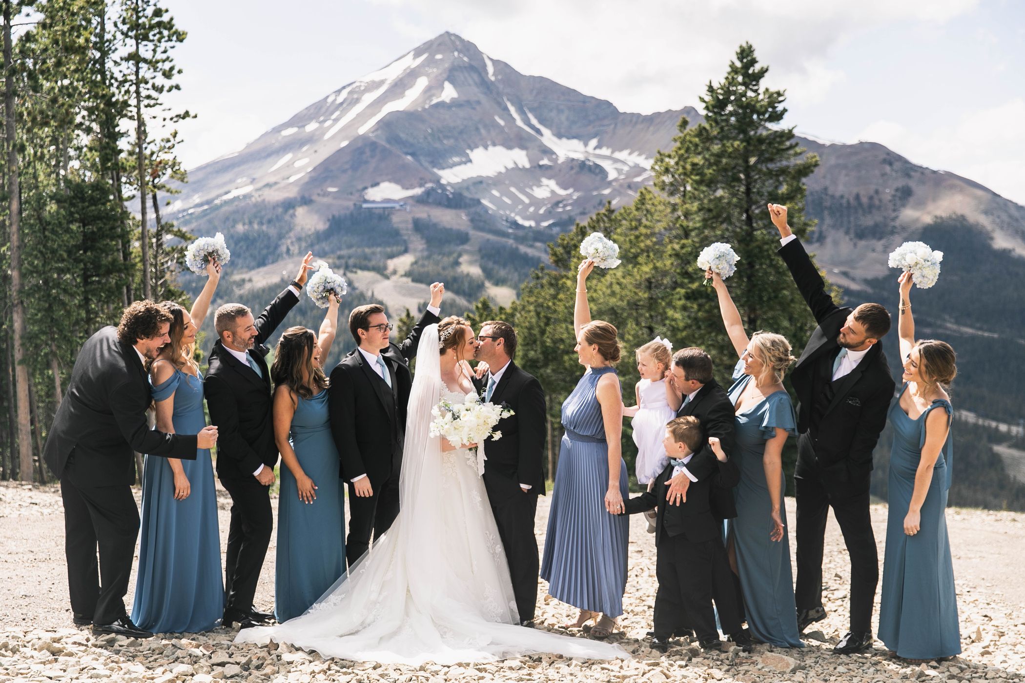 Wedding party outside with Lone Mountain in the background