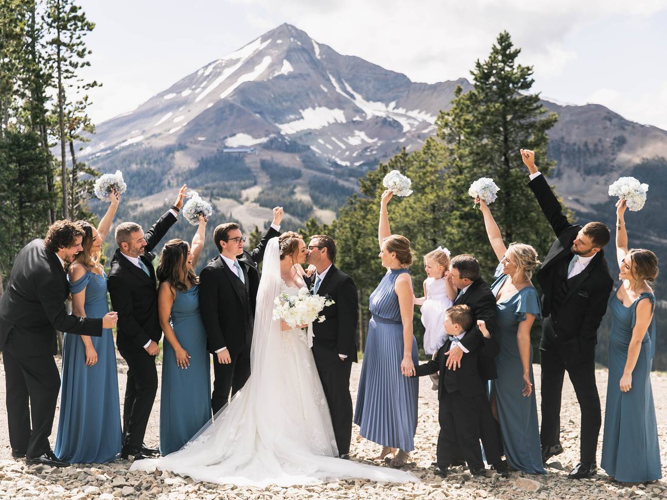 Wedding party outside with Lone Mountain in the background