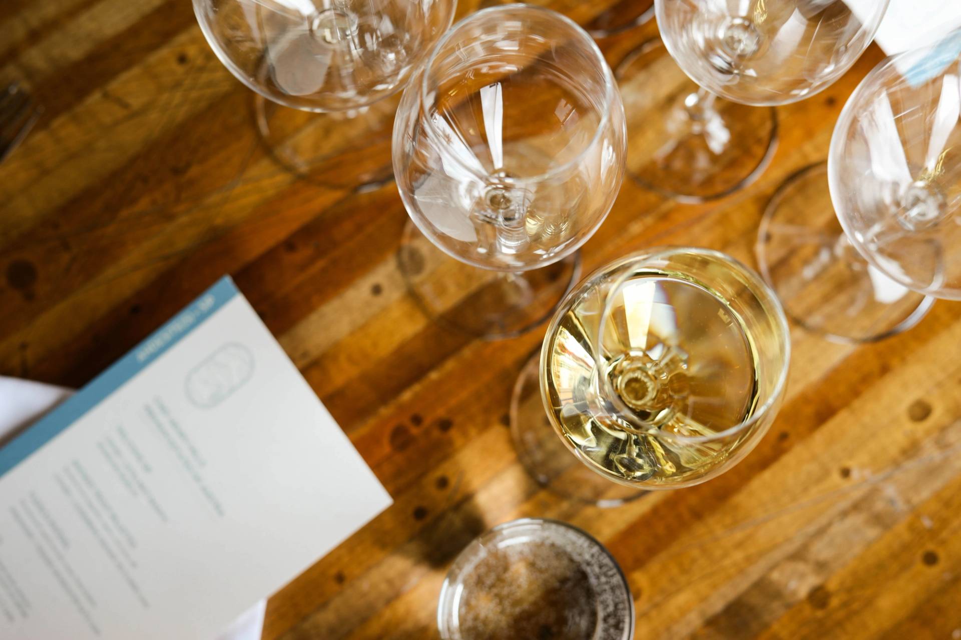 Wine glasses cheersing in front of Lone Peak