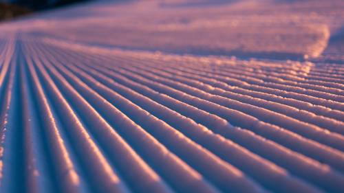 Groomed ski trail at sunrise