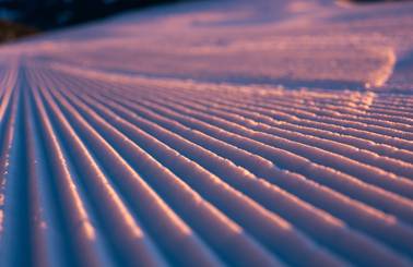 Sunrise over corduroy snow