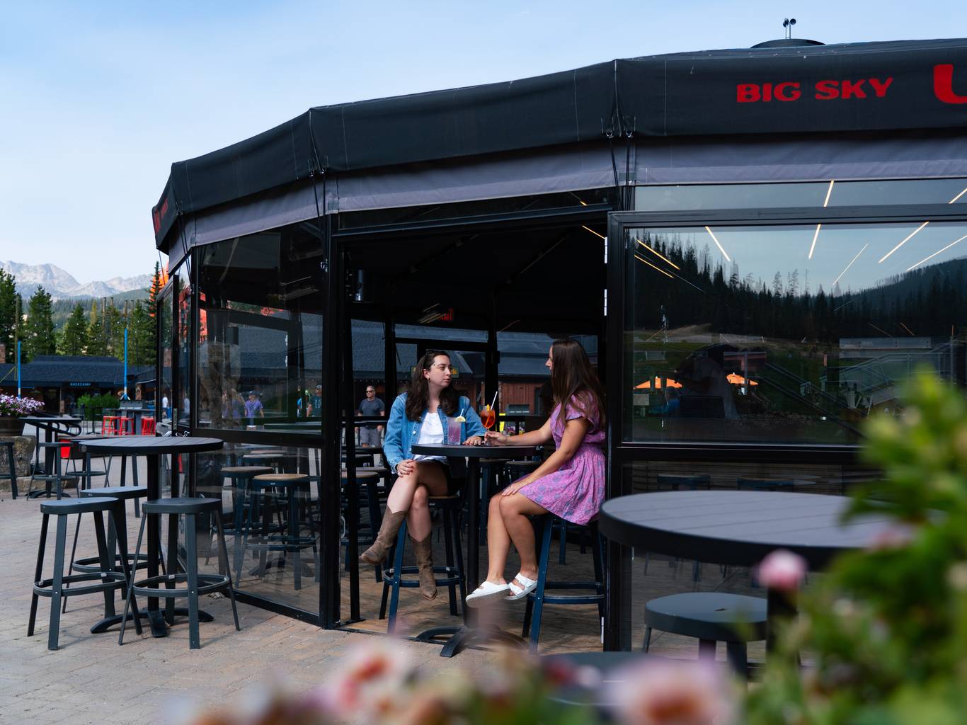 People in ski gear with drinks in the Umbrella Bar
