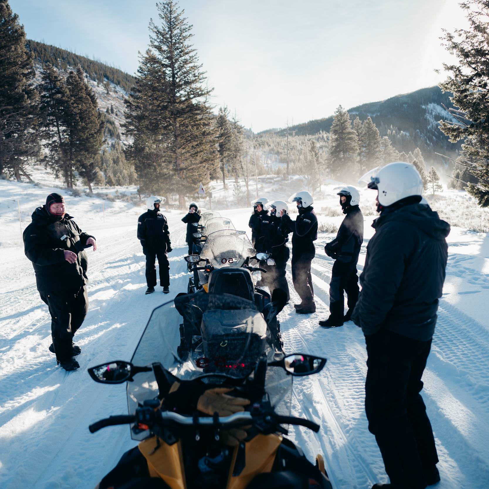 Group of snowmobilers in winter