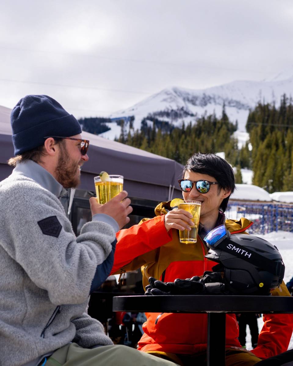 People in ski gear with drinks at the Umbrella Bar