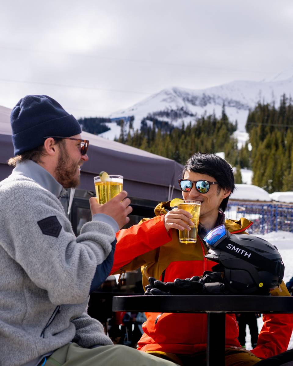 People in ski gear with drinks at the Umbrella Bar