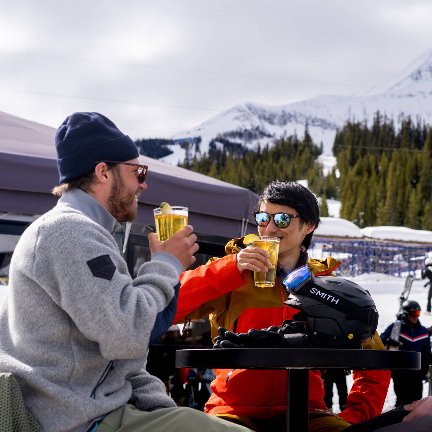 Group of skiers with drinks at the Umbrella Bar