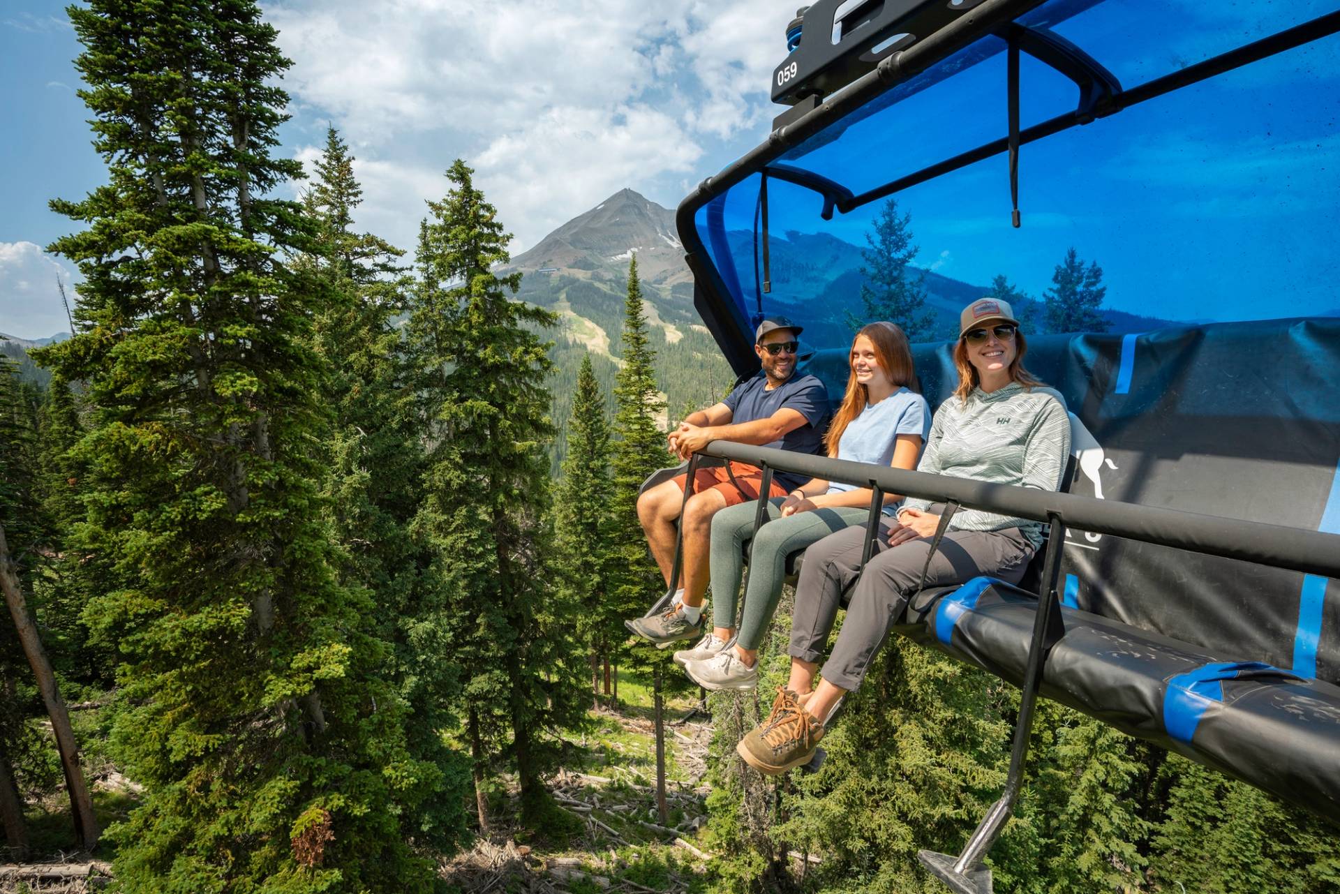 Family on a chairlift in summer