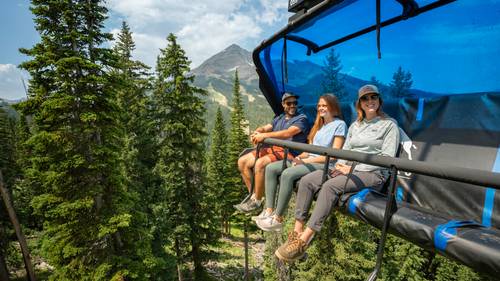 Family on a chairlift in summer