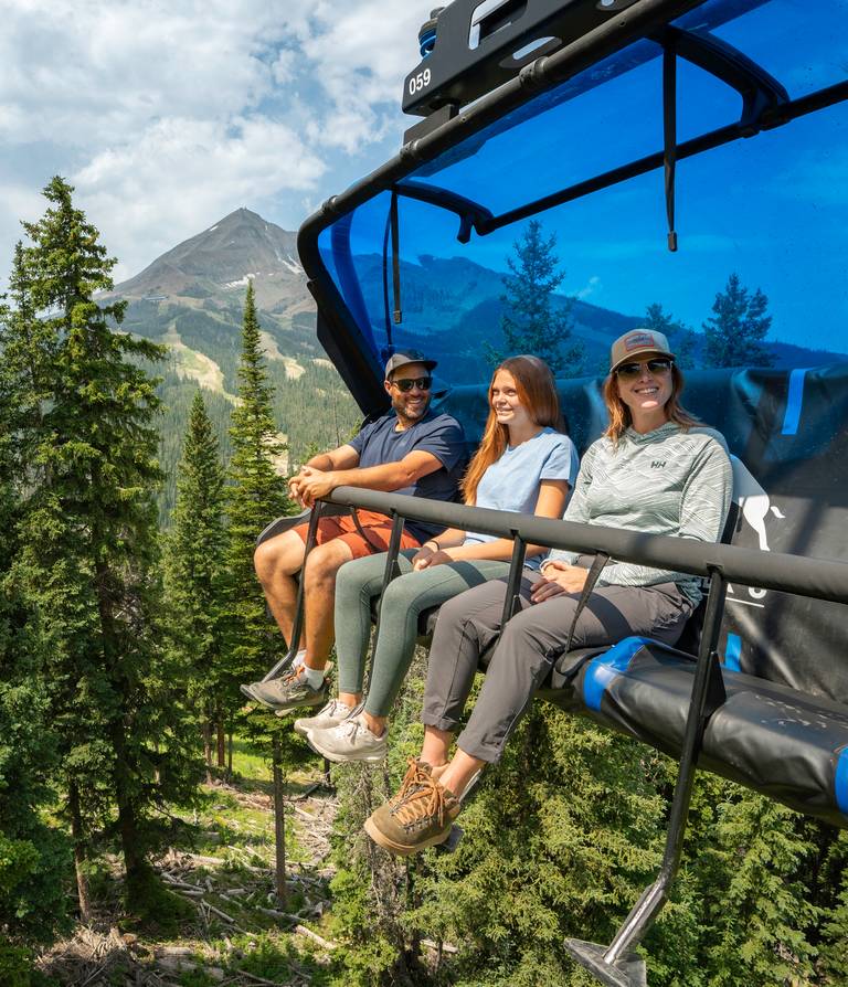 Family on a scenic chairlift ride in summer
