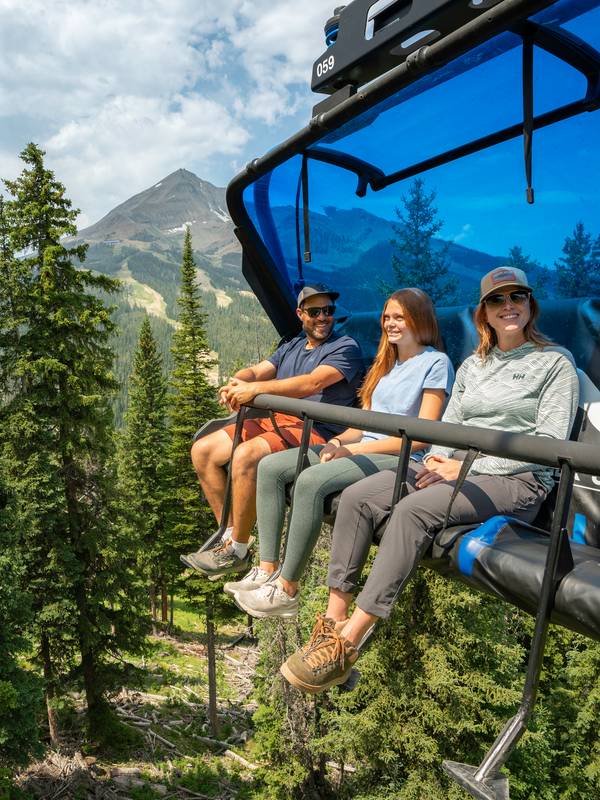 Family on a chairlift in summer