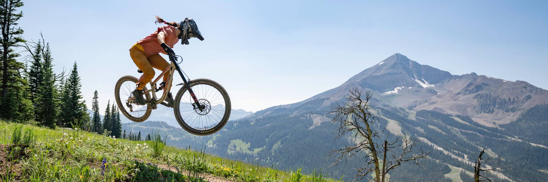 Mountain biker in front of Lone Mountain