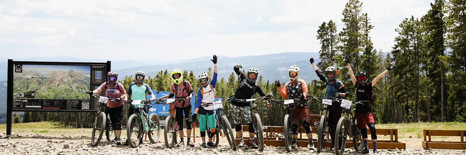 Woman riding her mountain bike around a corner