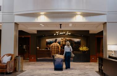 Couple checking in to the Summit Hotel
