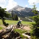 Mountain Biker in front of Lone Mountain