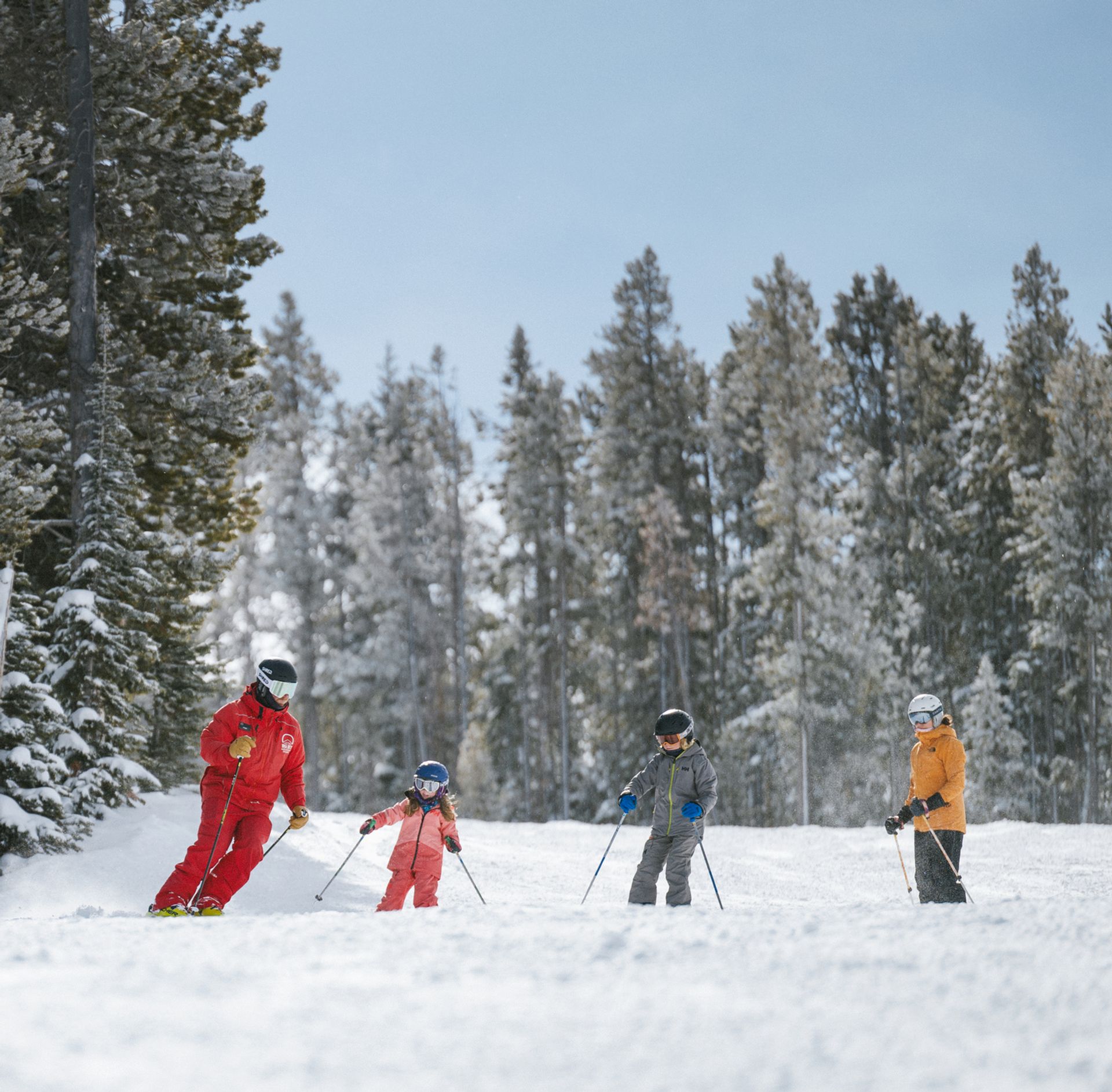 Family in with a Big Sky Resort ski instructor