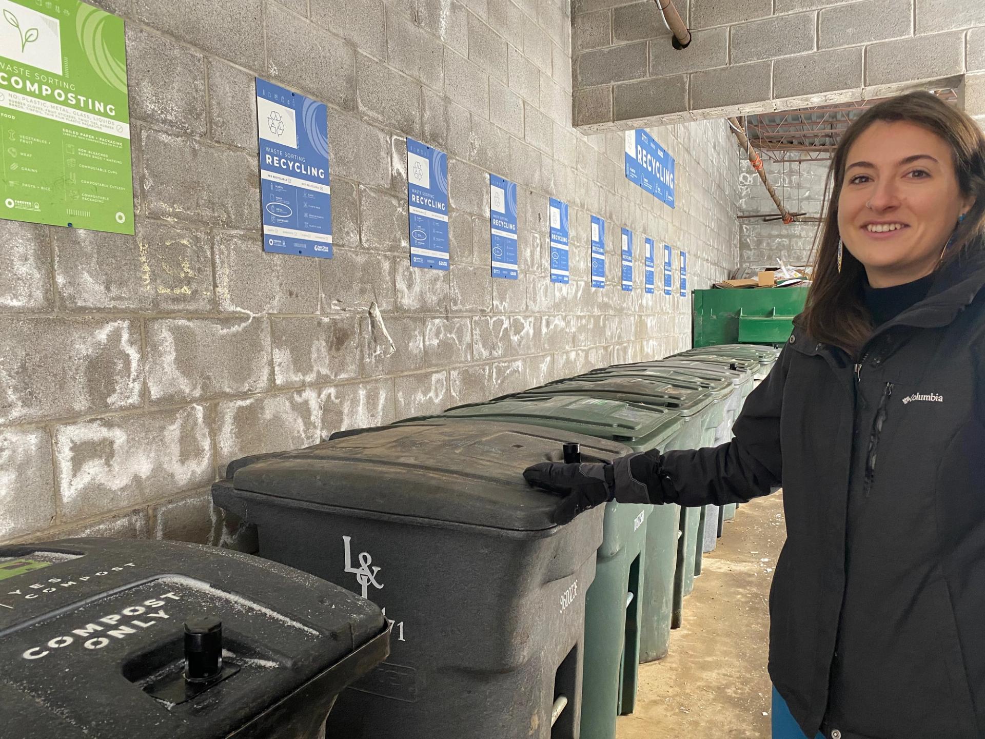 Amy in front of the sorted waste at the resort