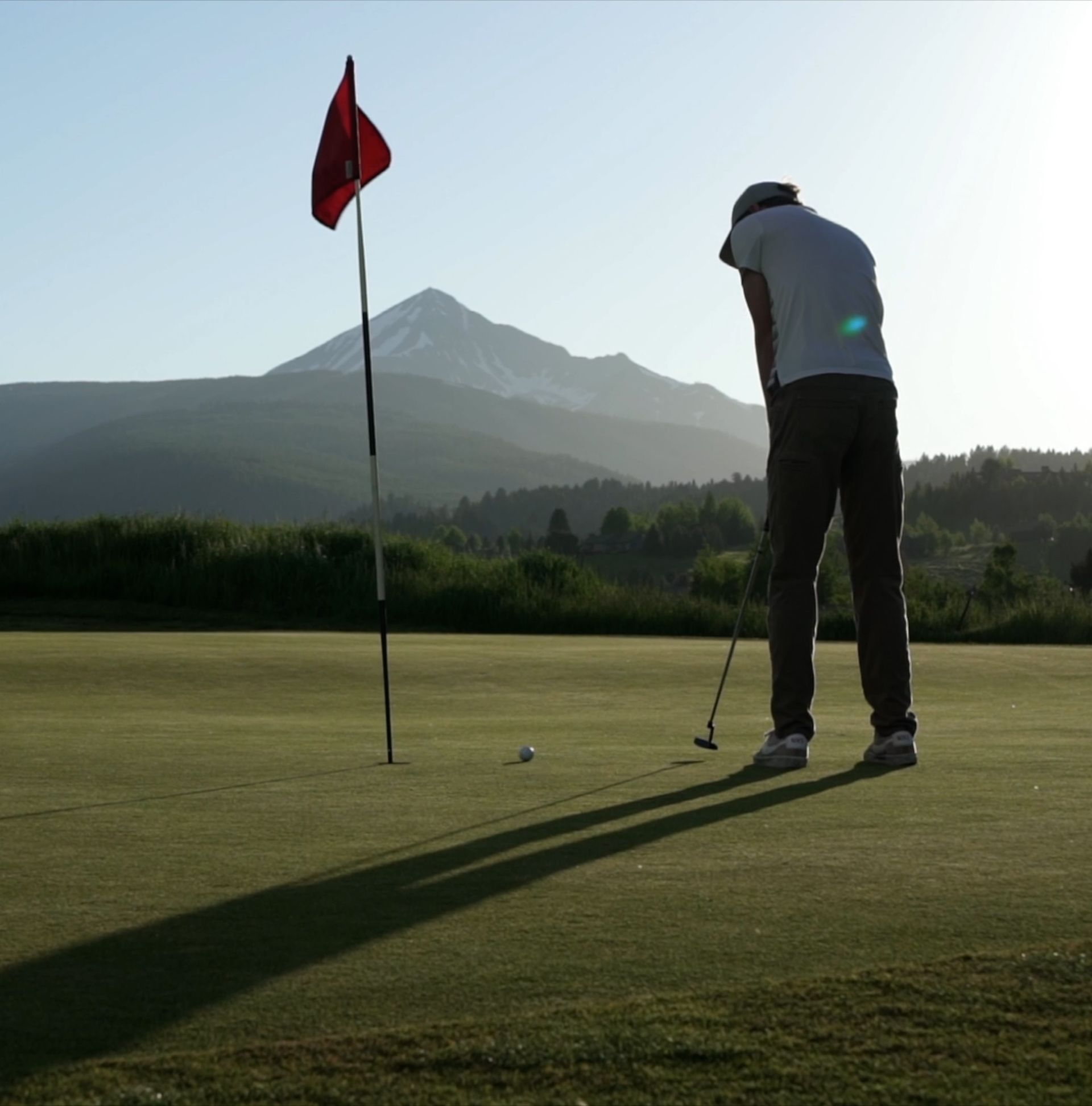 Golfer with Lone Mountain in the background