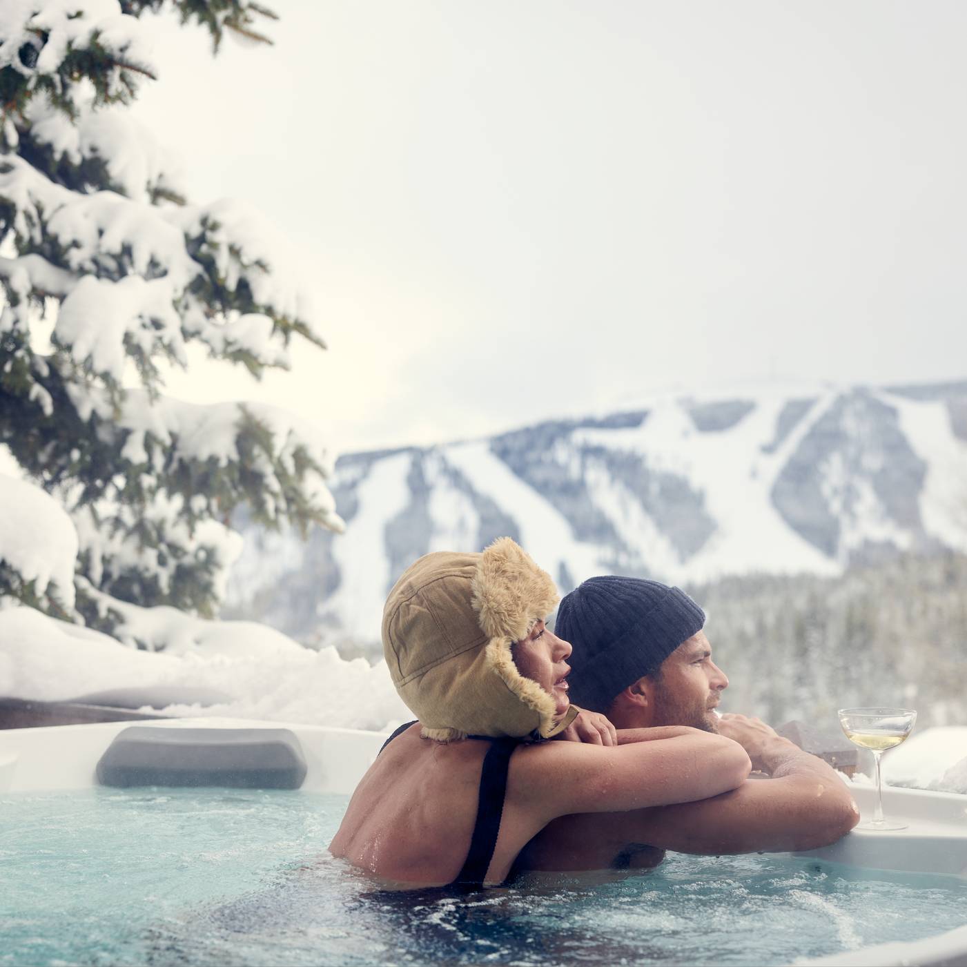 Couple in a hot tub in winter